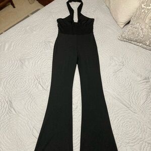 Black Halter Neck Sleeveless Backless Body Hugging Flared Leg Jumpsuit by Adika